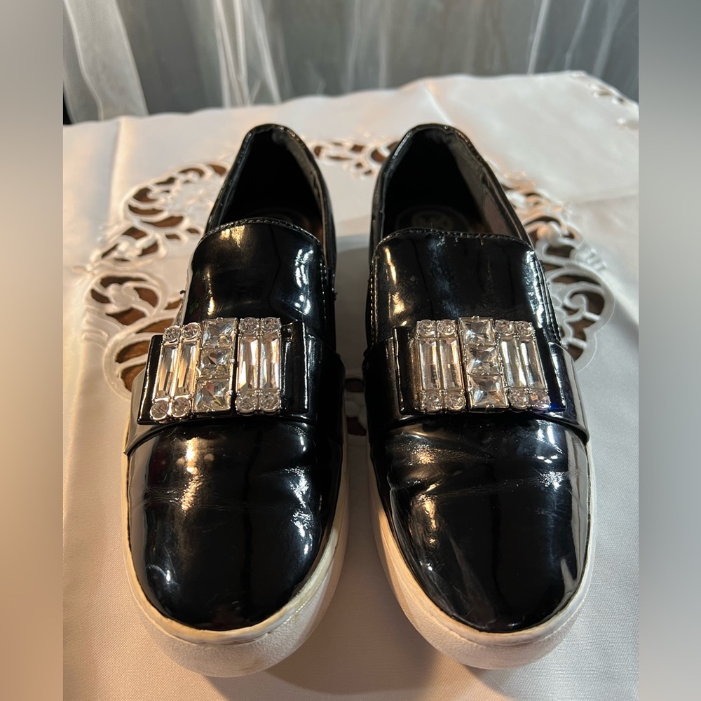 Michael Kors black shiny sneakers with cute silver stones. Very comfortable 8.5